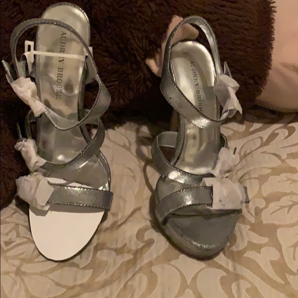Metallic silver pumps. Never wore